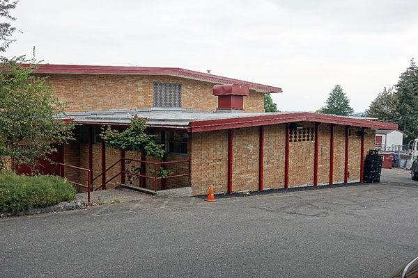 painted steel supports on a brick building