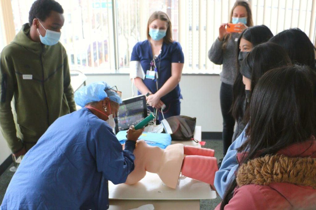 The HOSA (Health Occupation Students of America) clubs from Rainier Beach and Franklin High School visited Harborview's Injury Prevention Research Center where they learned more about injury and violence prevention careers. observing a life saving scenario