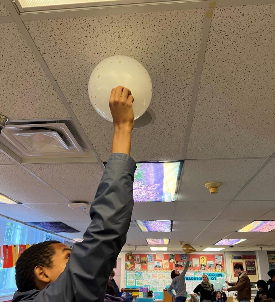 students using a balloon for an experiment