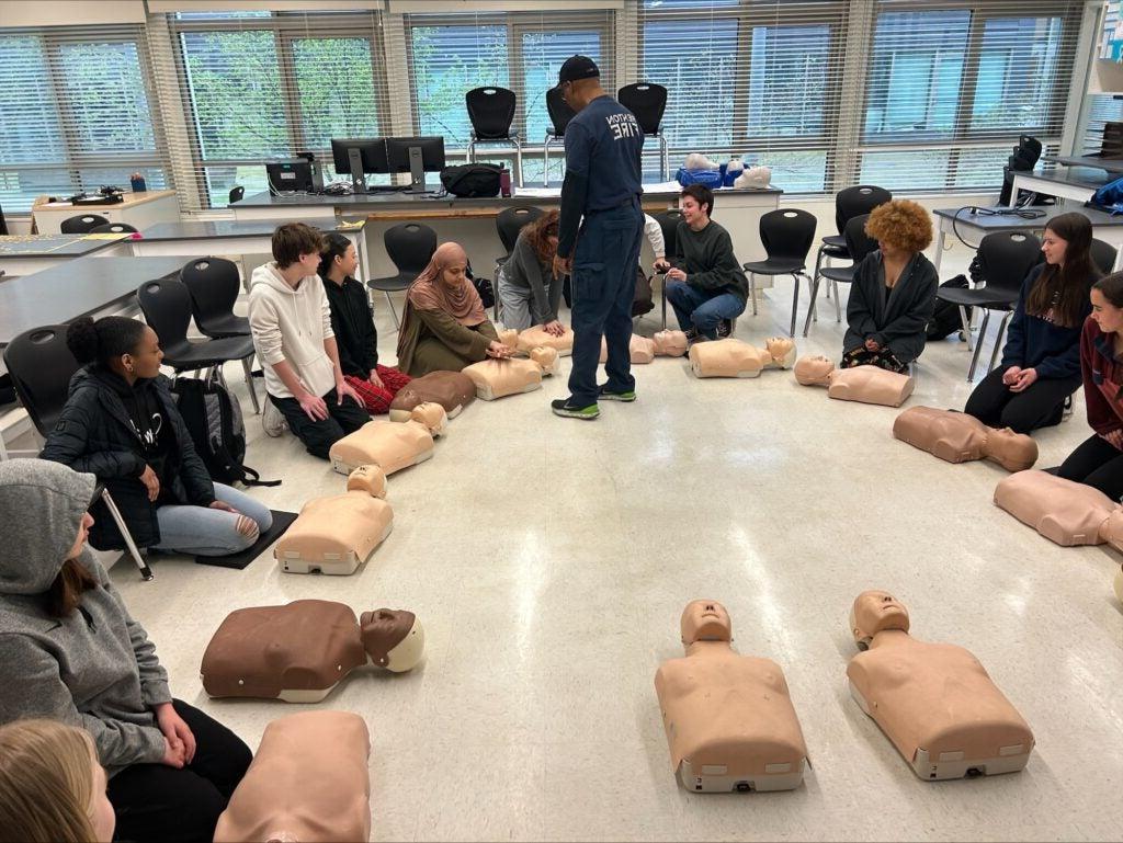 Students training CPR