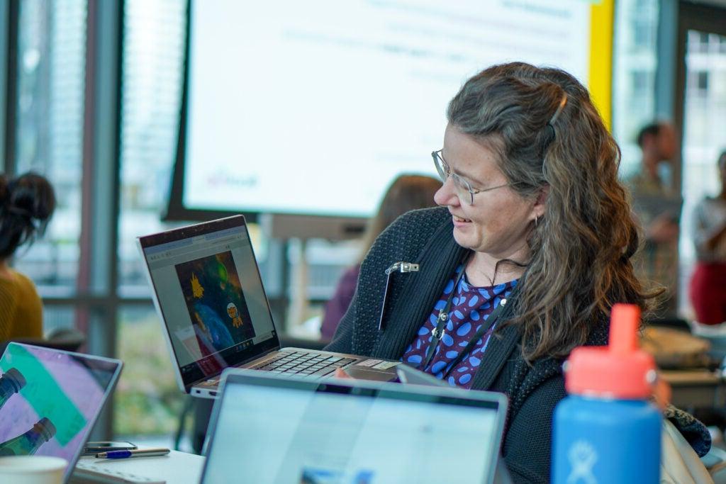 Person sitting at computer during work group with CTE